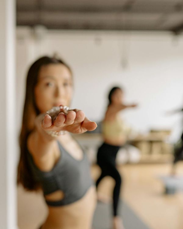 Woman in a calm yoga pose, focused on balance and inner peace.